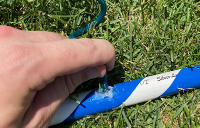 Caulk is applied around a water mister.